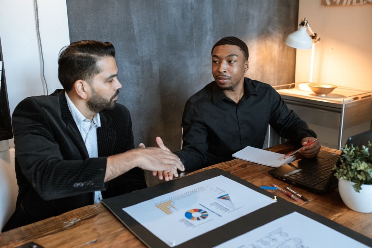 Two people reviewing business data together